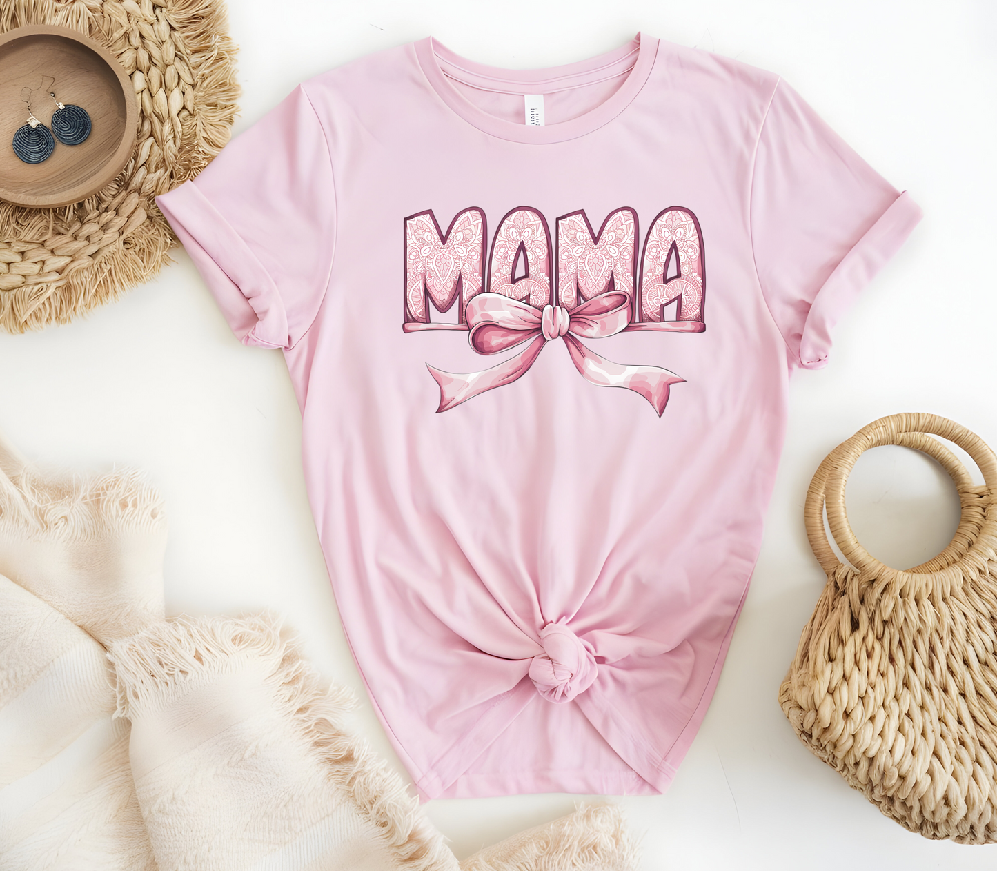 Woman’s T-Shirt featuring the graphic design “Mama in pink with a delicate pattern and a pink coquette bow”