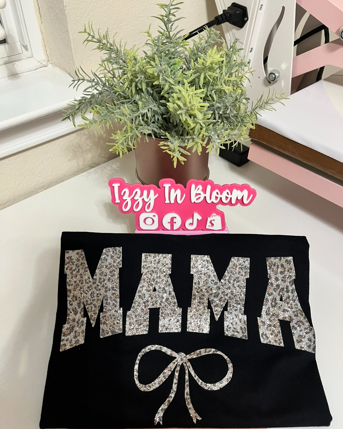 Mom Inspired Leopard Print Woman’s Tshirt Featuring the word “Mama with a pretty coquette bow”