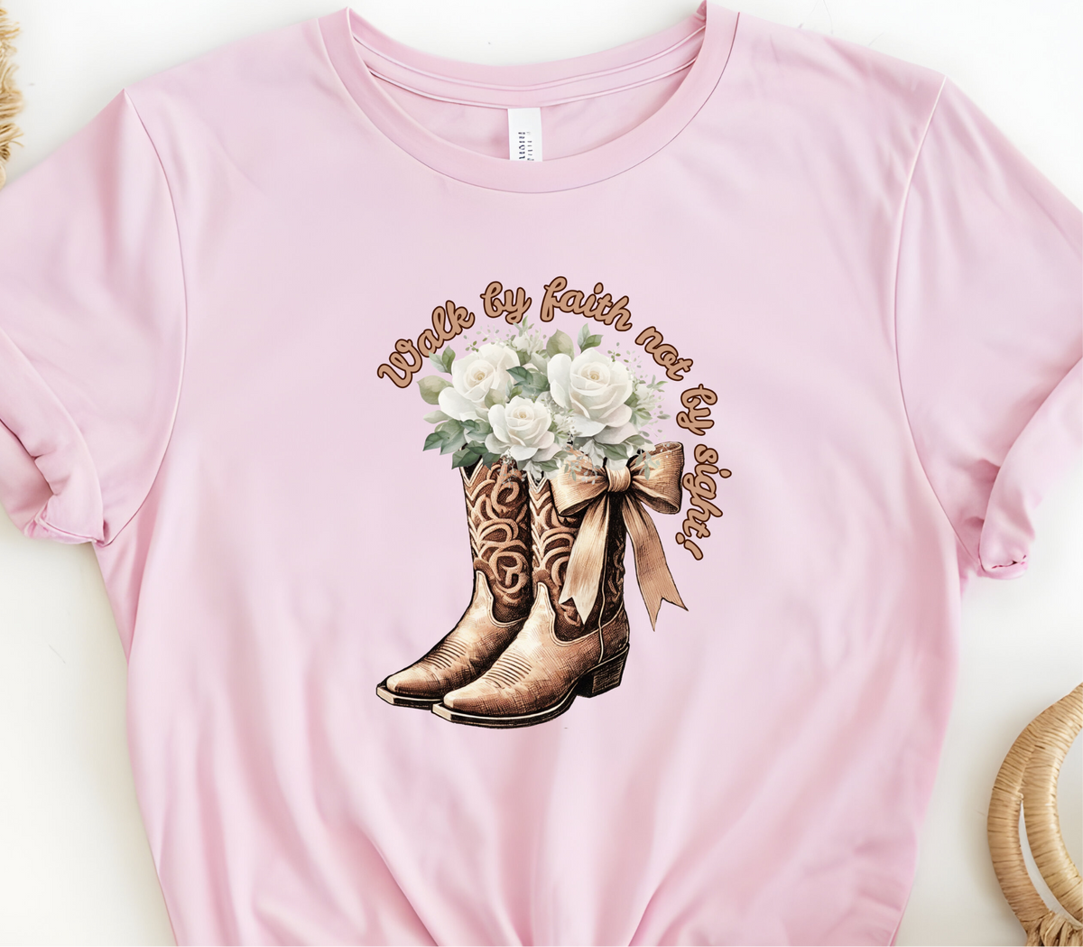 Faith Based Woman’s T-Shirt Featuring Cowgirl boots, White Flowers and The Message “Walk by faith not by sight!”