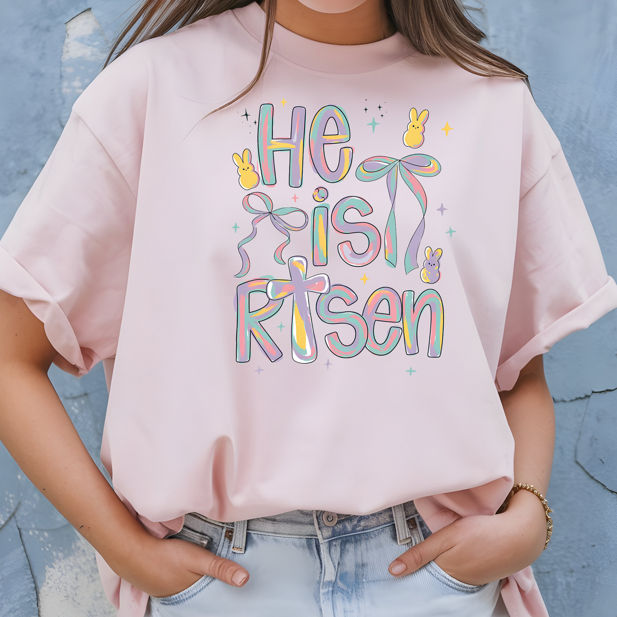 Faith Based Easter Apparel with message “He Is Risen Easter”.