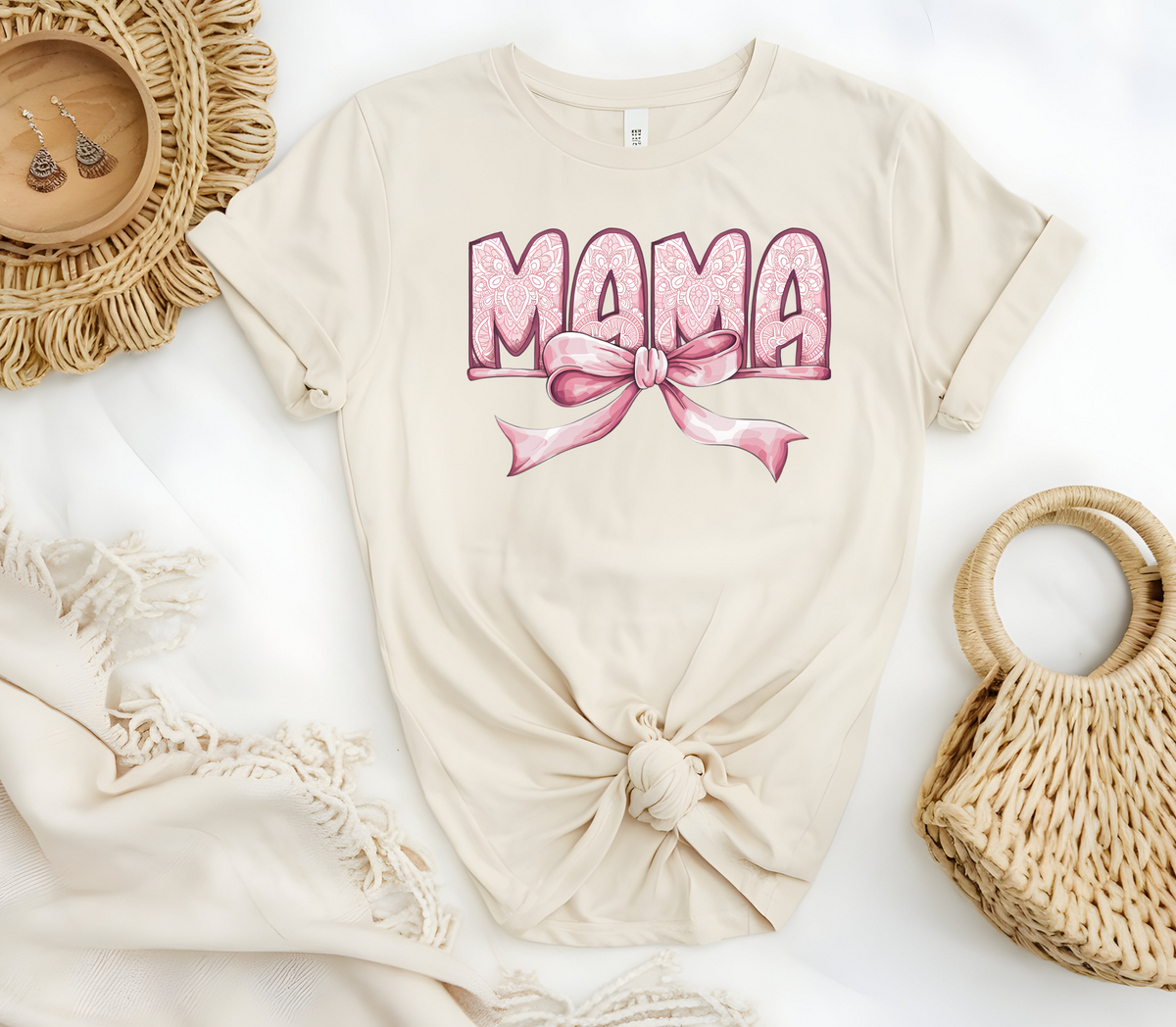 Woman’s T-Shirt featuring the graphic design “Mama in pink with a delicate pattern and a pink coquette bow”
