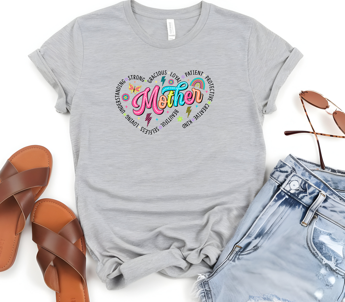 Mothers Day Inspired T-Shirt featuring the message “Mother, surrounded by two hearts and the words, Understanding, Strong, Gracious, Loyal, Loving, Selfless, Beautiful, Patient, Protective, Creative & Kind”