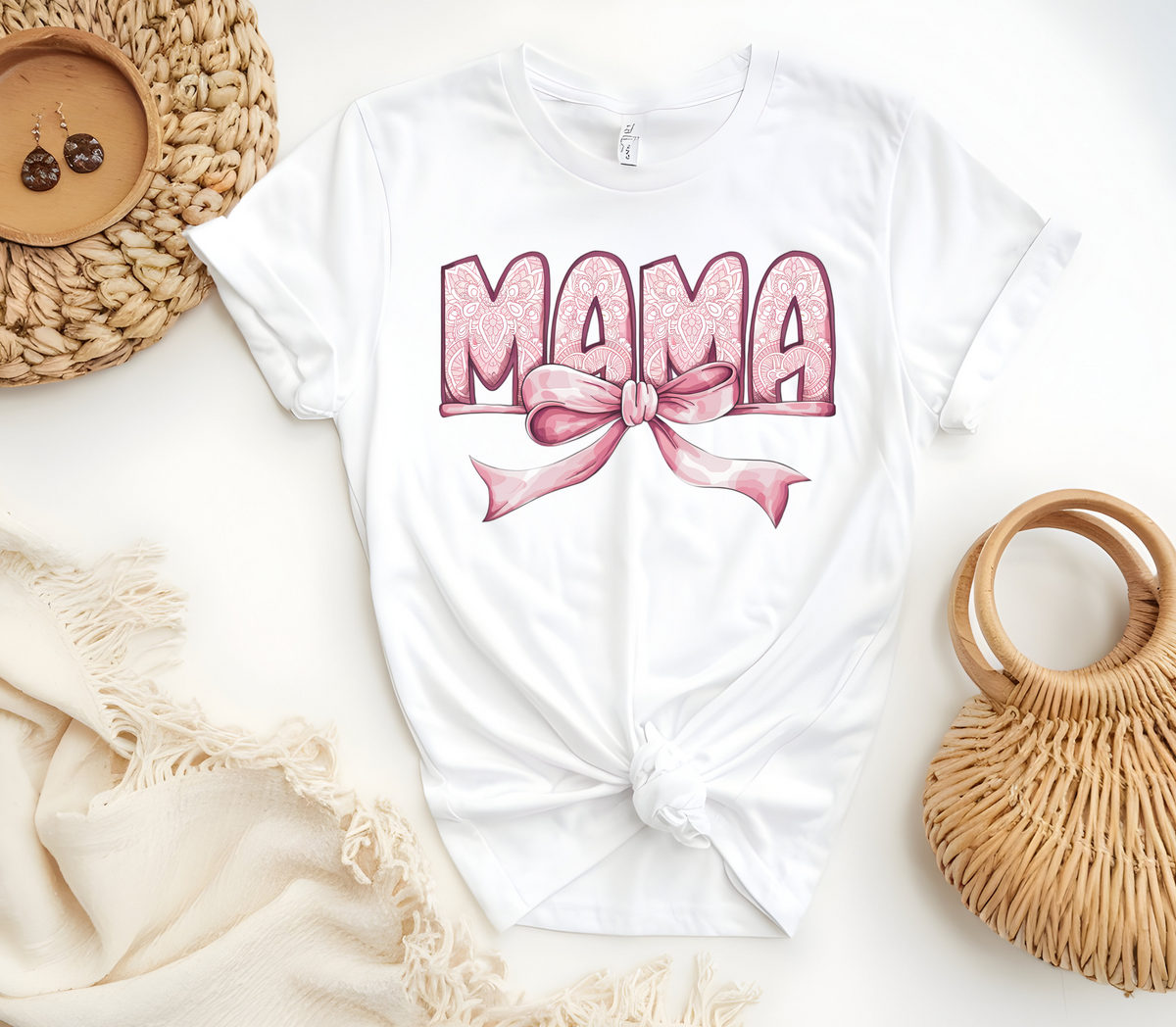 Woman’s T-Shirt featuring the graphic design “Mama in pink with a delicate pattern and a pink coquette bow”