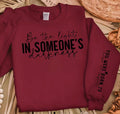 Faith Based Crewneck Sweatshirt featuring the message “Be The Light In Someone’s Darkness, You Were Born To Make An Impact”