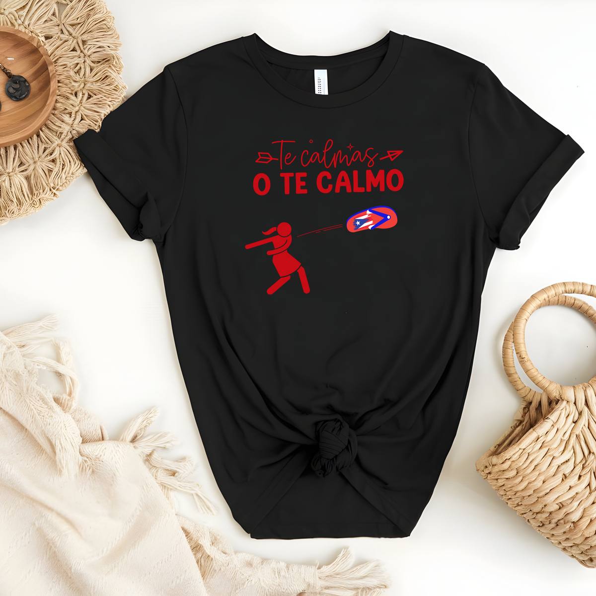 Puerto Rican Chancla Themed Woman’s T-Shirt featuring, a Spanish message “Te Calmas O Te Calmo” with a graphic picture of a mom throwing a flip flop/chancla in Spanish.