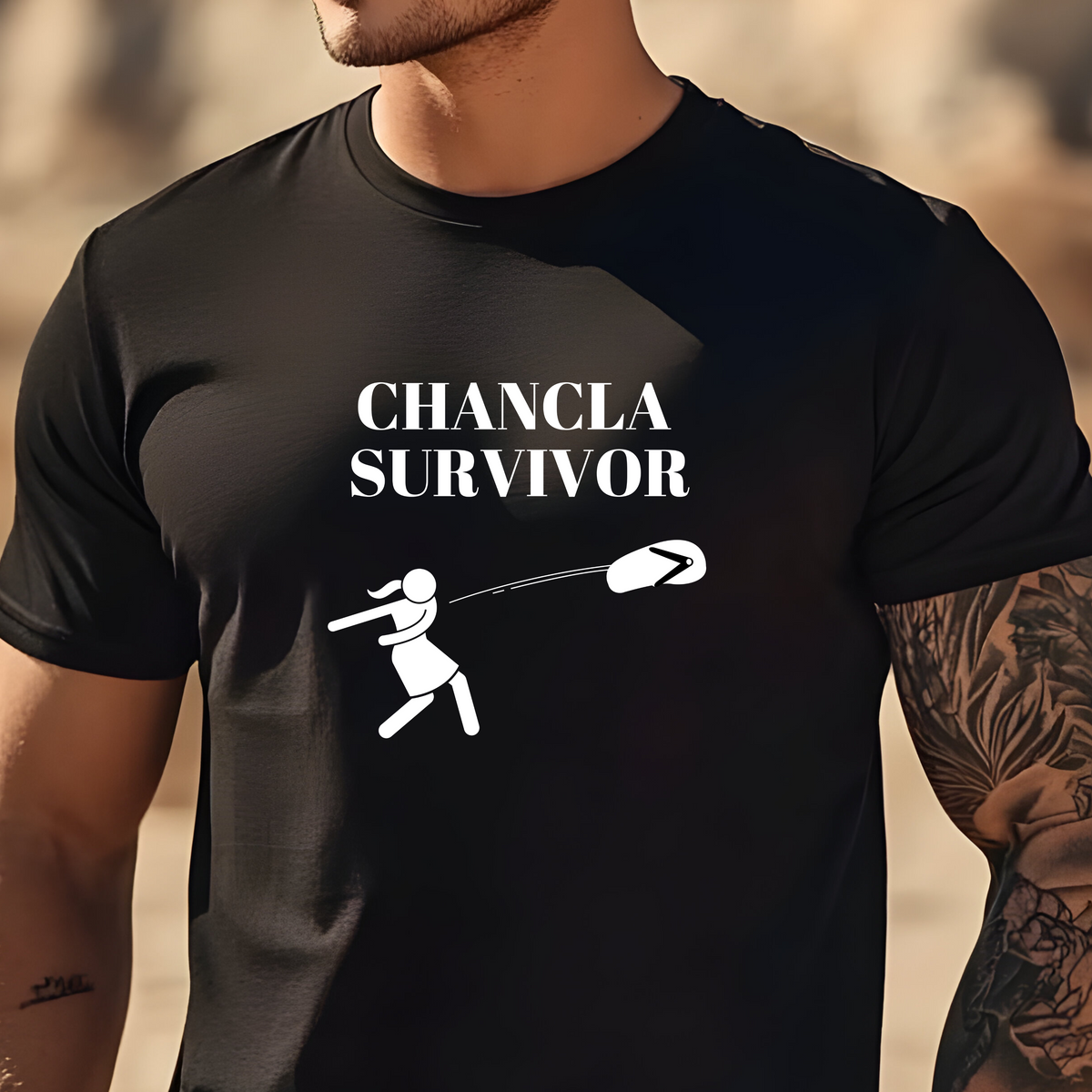 Sarcastic and humorous men’s t-shirt featuring the graphic picture of a mom throwing a flip-flop and the message “chancla survivor”.