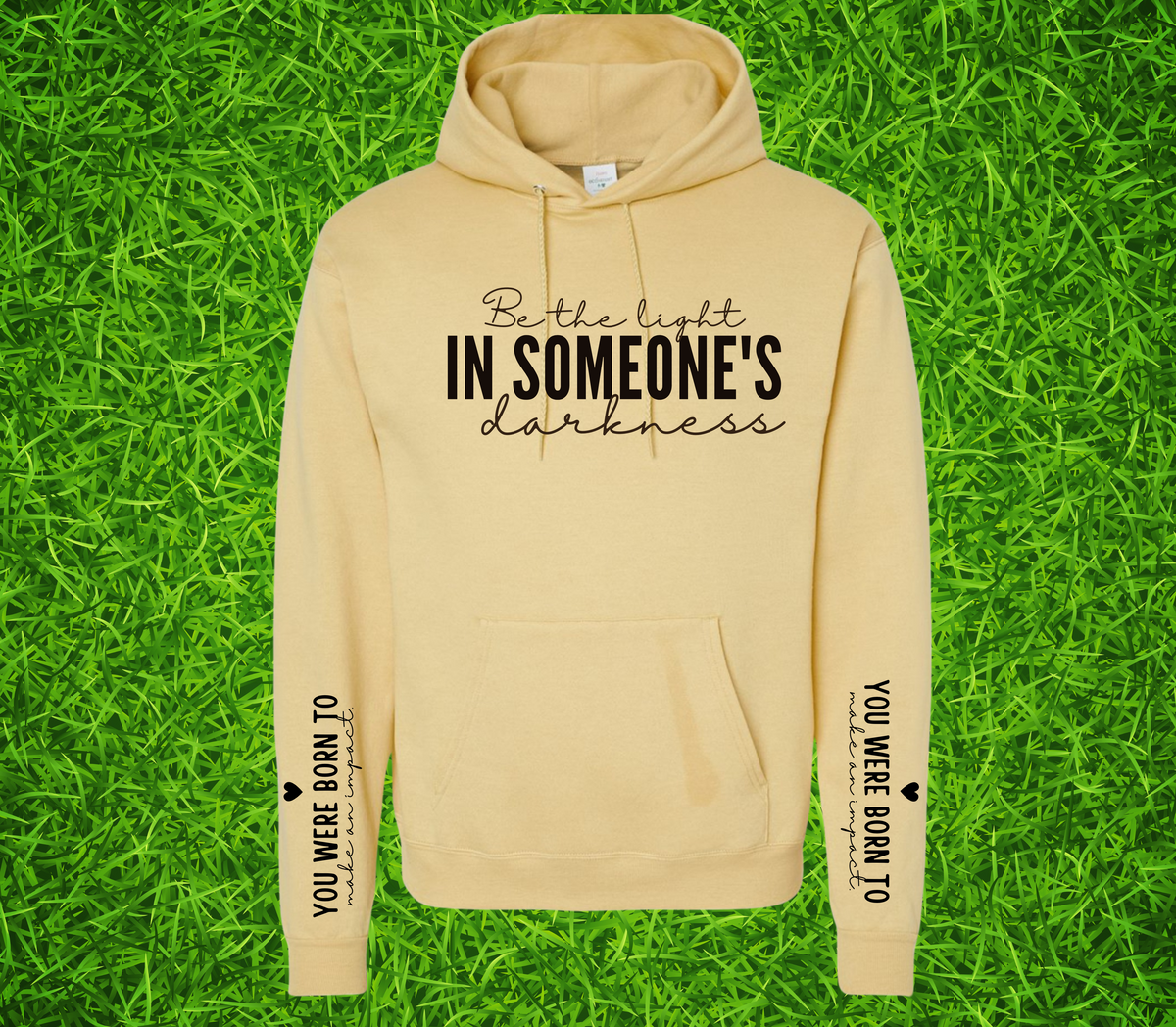 Faith Based Woman’s Hoodie, with the front message, "Be the Light In Someone's Darkness," and the empowering sleeve message, "You Were Born To Make An Impact," (Sleeve print can go on L or R sleeve.)