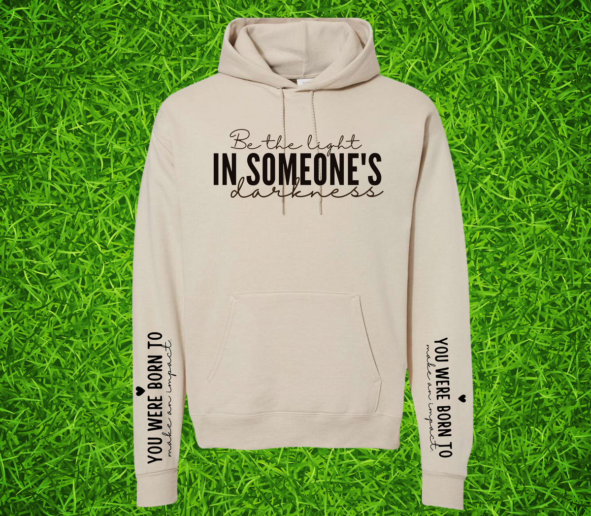 Faith Based Woman’s Hoodie, with the front message, "Be the Light In Someone's Darkness," and the empowering sleeve message, "You Were Born To Make An Impact," (Sleeve print can go on L or R sleeve.)