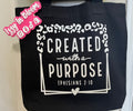 Black 16x15X3 100% Cotton Tote Bag featuring the message “Created With A Purpose” along with the Biblical Scripture Ephesians 2:10.