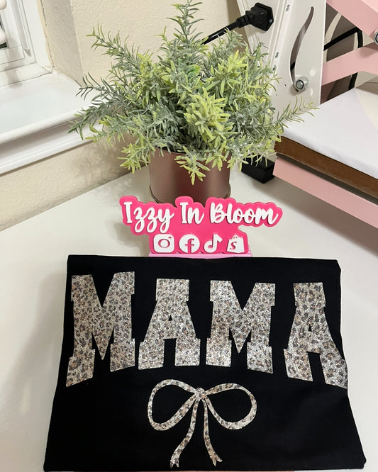 Mom Inspired Leopard Print Woman’s Tshirt Featuring the word “Mama with a pretty coquette bow”